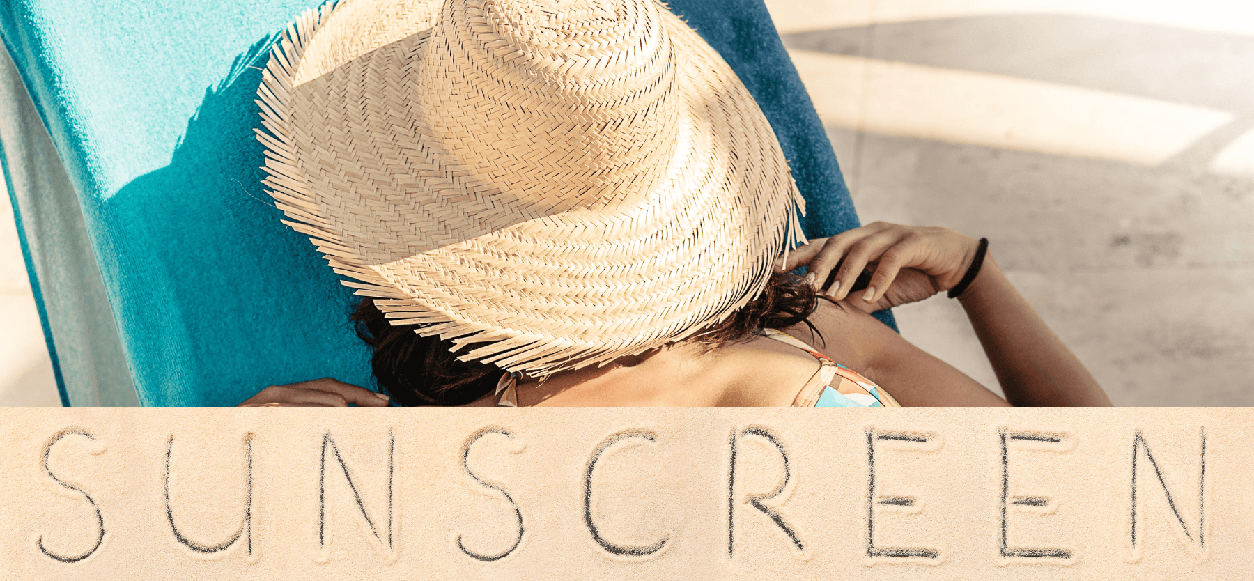 Sunscreen written in sand